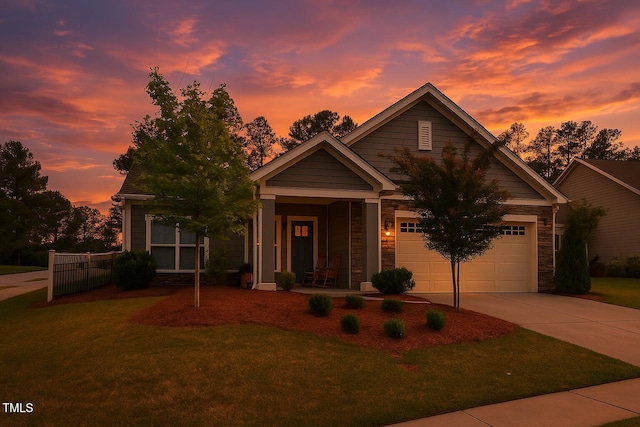 1357 Prevenient Dr, Wake Forest, NC 27587 - view of front of home featuring driveway, covered porch, a garage, and stone siding