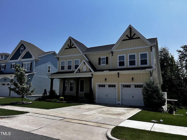 1131 Lowland St, Apex, NC 27523 - craftsman-style home with board and batten siding, an attached garage, and a front yard