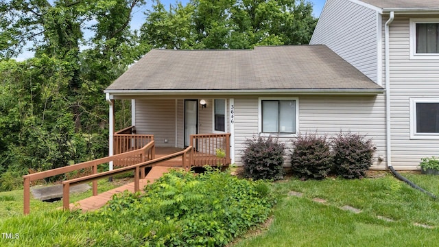 3646 Heathrow Dr, Winston-Salem, NC 27127 - view of front of house featuring a deck, a front yard, and a shingled roof