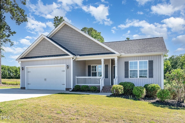41 Tan Oak Dr, Selma, NC 27576 - view of front of house with board and batten siding, a porch, a garage, driveway, and a front lawn