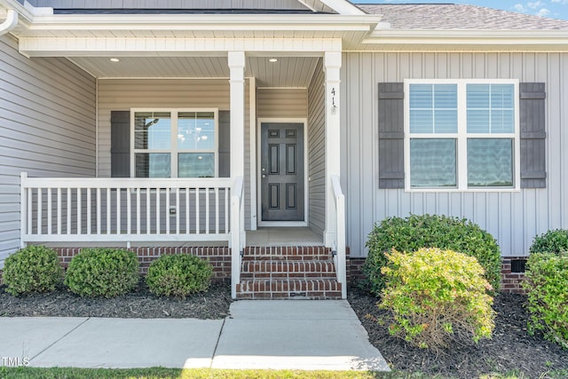 41 Tan Oak Dr, Selma, NC 27576 - property entrance with board and batten siding, a porch, and a shingled roof