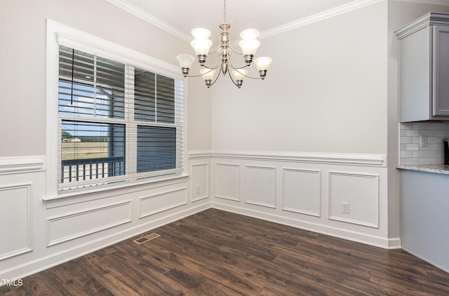 41 Tan Oak Dr, Selma, NC 27576 - unfurnished dining area featuring a chandelier, ornamental molding, dark wood-style floors, wainscoting, and a decorative wall