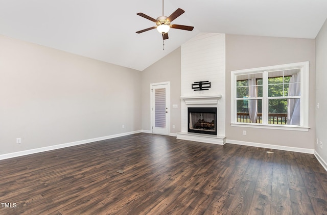 41 Tan Oak Dr, Selma, NC 27576 - unfurnished living room featuring a ceiling fan, high vaulted ceiling, a fireplace, dark wood finished floors, and baseboards