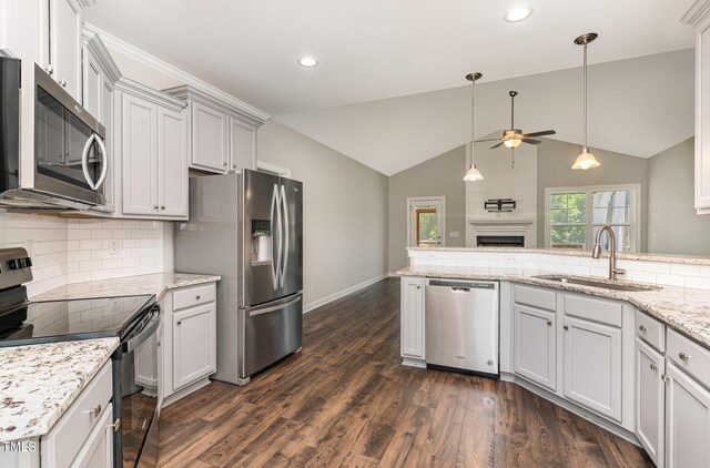41 Tan Oak Dr, Selma, NC 27576 - kitchen with stainless steel appliances, ceiling fan, a sink, recessed lighting, and baseboards