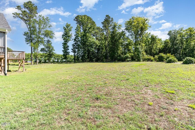 41 Tan Oak Dr, Selma, NC 27576 - view of grassy yard with a deck
