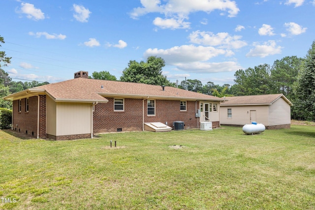 4804 Spring Forest Rd, Raleigh, NC 27616 - back of property featuring brick siding, a yard, roof with shingles, a chimney, and crawl space