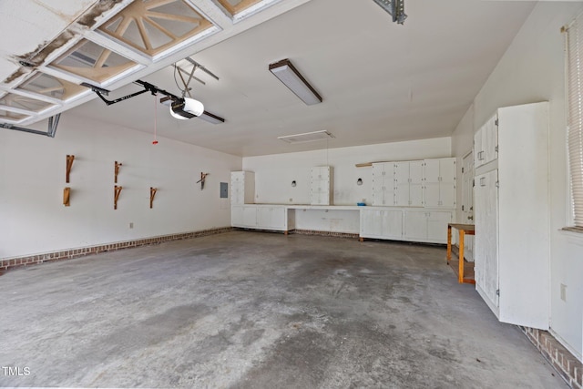 4804 Spring Forest Rd, Raleigh, NC 27616 - garage featuring a garage door opener and electric panel