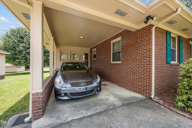 4804 Spring Forest Rd, Raleigh, NC 27616 - view of home's exterior featuring an attached carport, brick siding, a lawn, and driveway