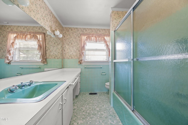 4804 Spring Forest Rd, Raleigh, NC 27616 - full bath with crown molding, vanity, tile walls, wallpapered walls, and wainscoting