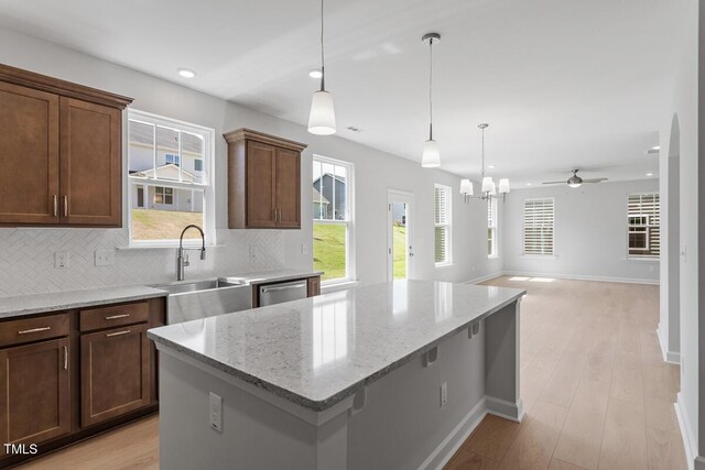 257 N Maple Walk Dr Unit 218, Garner, NC 27529 - kitchen featuring a sink, dishwasher, decorative backsplash, a center island, and recessed lighting