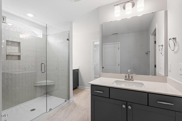 257 N Maple Walk Dr Unit 218, Garner, NC 27529 - full bath featuring vanity, a stall shower, marble finish floors, and baseboards