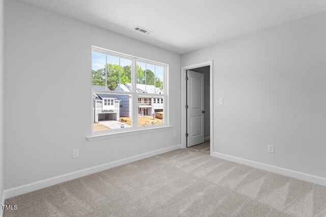 257 N Maple Walk Dr Unit 218, Garner, NC 27529 - carpeted spare room featuring baseboards