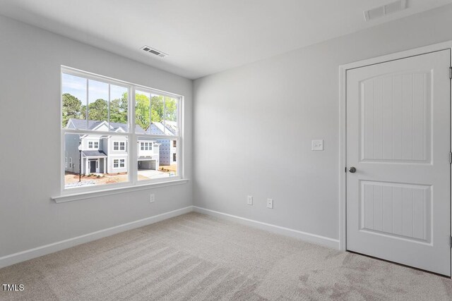 257 N Maple Walk Dr Unit 218, Garner, NC 27529 - carpeted empty room featuring baseboards