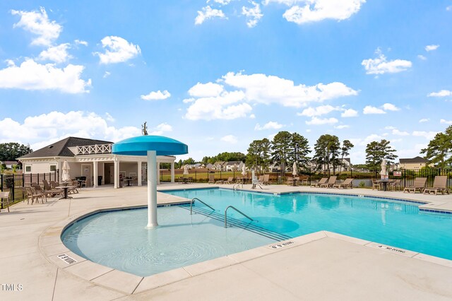 257 N Maple Walk Dr Unit 218, Garner, NC 27529 - community pool featuring a patio