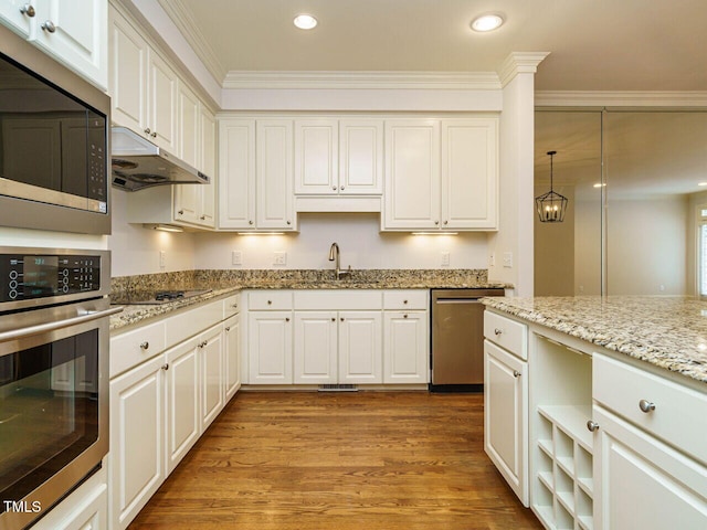 3339 Ridgecrest Ct, Raleigh, NC 27607 - kitchen featuring appliances with stainless steel finishes, under cabinet range hood, crown molding, wood finished floors, and white cabinetry