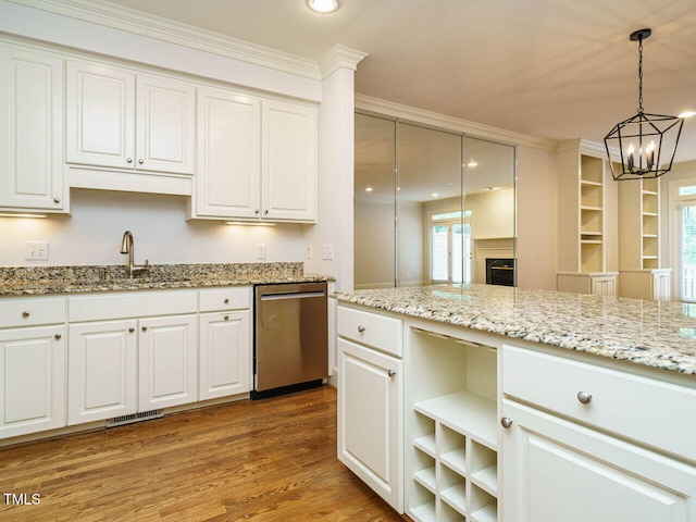 3339 Ridgecrest Ct, Raleigh, NC 27607 - kitchen with dishwasher, a chandelier, ornamental molding, white cabinetry, and recessed lighting