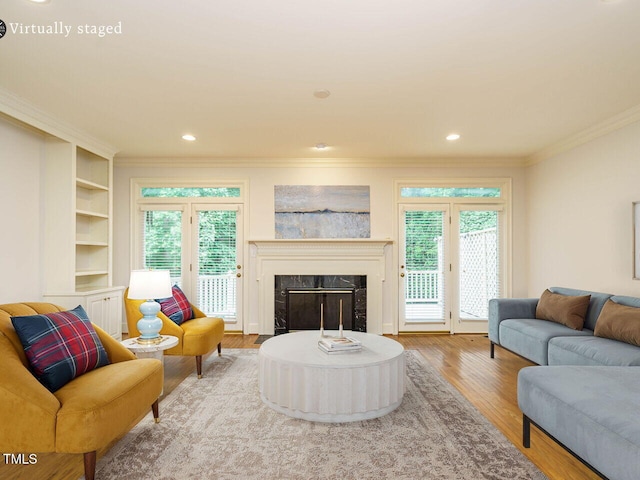 3339 Ridgecrest Ct, Raleigh, NC 27607 - living area with ornamental molding, wood finished floors, a fireplace, healthy amount of natural light, and recessed lighting