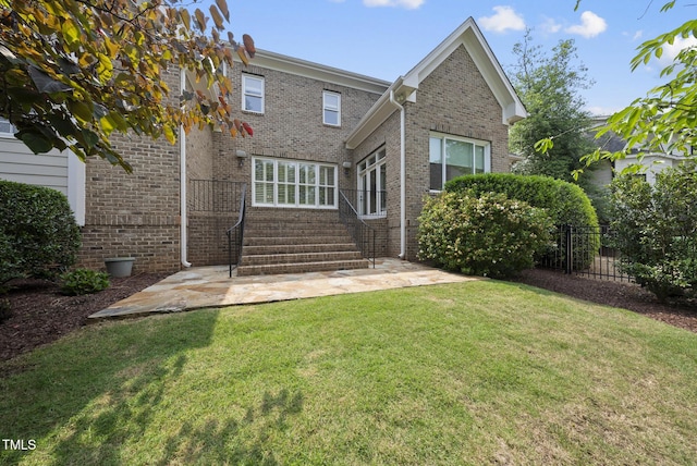 1210 Brooks Ave, Raleigh, NC 27607 - rear view of house featuring brick siding and a patio area