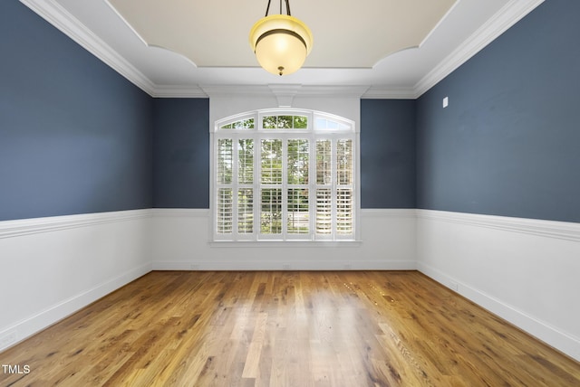 1210 Brooks Ave, Raleigh, NC 27607 - spare room with wood finished floors, crown molding, and baseboards