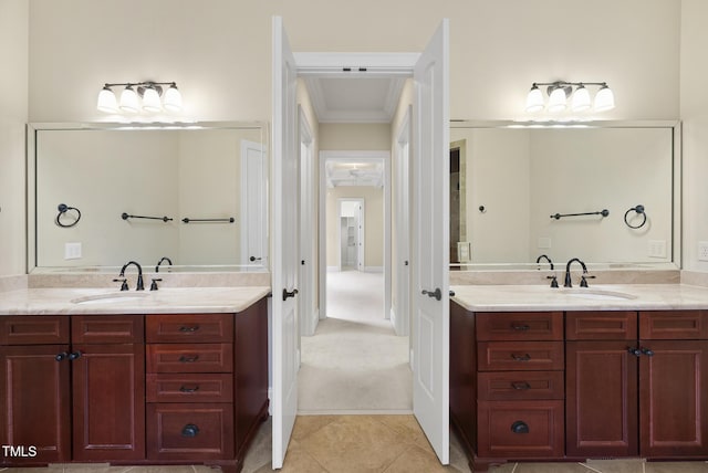 1210 Brooks Ave, Raleigh, NC 27607 - full bath with two vanities, crown molding, and tile patterned flooring