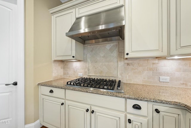 1210 Brooks Ave, Raleigh, NC 27607 - kitchen featuring extractor fan, stainless steel gas stovetop, and decorative backsplash