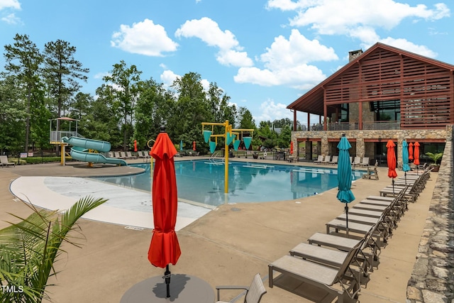 1728 Shady Oaks Dr, Wendell, NC 27591 - community pool featuring a water slide and a patio
