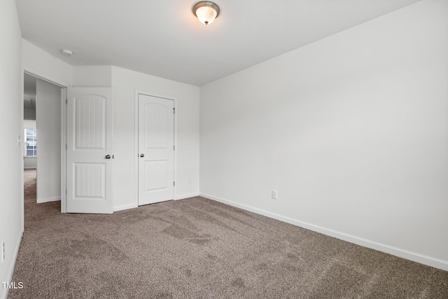1728 Shady Oaks Dr, Wendell, NC 27591 - unfurnished bedroom featuring carpet and baseboards