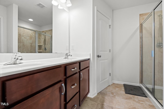 1728 Shady Oaks Dr, Wendell, NC 27591 - full bathroom featuring a shower stall, double vanity, and baseboards