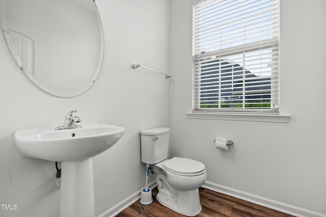 1728 Shady Oaks Dr, Wendell, NC 27591 - bathroom featuring baseboards, wood finished floors, and toilet