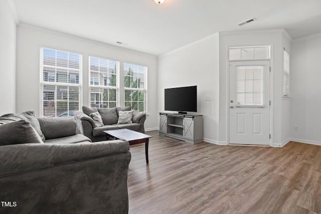 1728 Shady Oaks Dr, Wendell, NC 27591 - living room with crown molding, wood finished floors, and baseboards