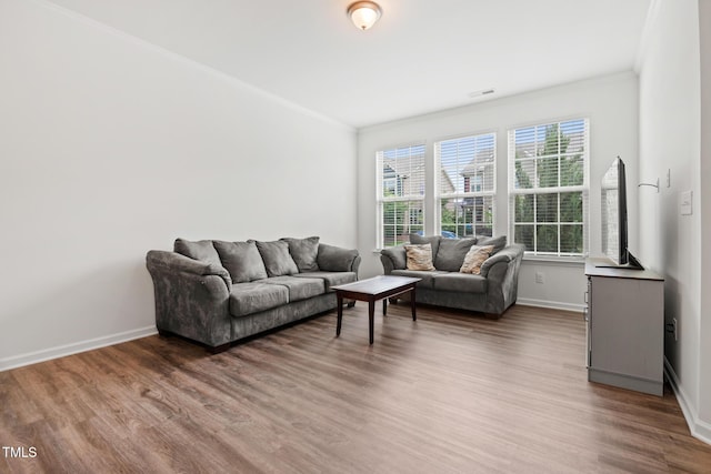 1728 Shady Oaks Dr, Wendell, NC 27591 - living area with crown molding, wood finished floors, and baseboards