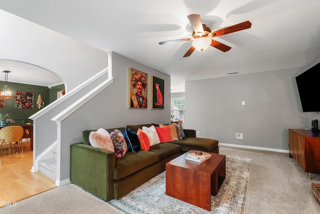 202 Stonecreek Dr, Apex, NC 27539 - living area featuring ceiling fan, stairs, baseboards, and carpet