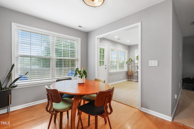 202 Stonecreek Dr, Apex, NC 27539 - dining room with baseboards and light wood-style floors