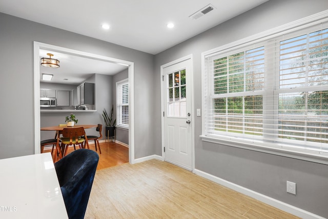 202 Stonecreek Dr, Apex, NC 27539 - entrance foyer featuring light wood-style flooring, plenty of natural light, baseboards, and recessed lighting