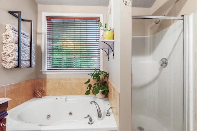 202 Stonecreek Dr, Apex, NC 27539 - full bath with a shower stall, a whirlpool tub, vanity, and a textured ceiling