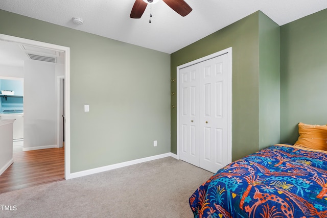 202 Stonecreek Dr, Apex, NC 27539 - carpeted bedroom featuring washer / dryer, a closet, a ceiling fan, and baseboards