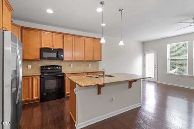 103 Ransomwood Dr, Apex, NC 27539 - kitchen featuring black appliances, dark wood finished floors, decorative backsplash, light stone counters, and ceiling fan