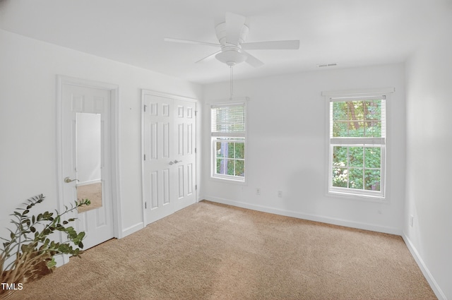 1437 Lindenberg Sq, Wake Forest, NC 27587 - unfurnished bedroom featuring carpet, a closet, and a ceiling fan