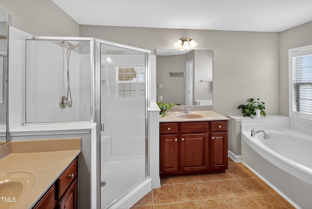 1437 Lindenberg Sq, Wake Forest, NC 27587 - bathroom with vanity, a stall shower, tile patterned floors, and a bath