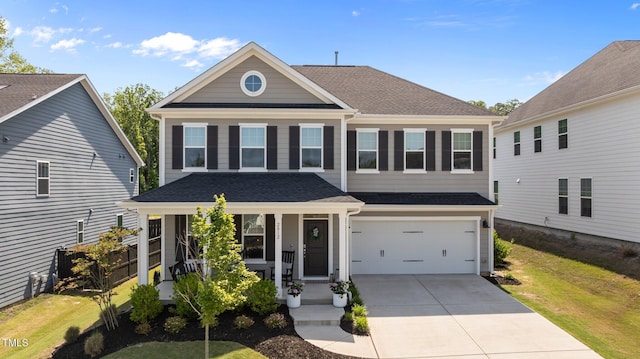 2012 Sweet Samson St, Wake Forest, NC 27587 - view of front of property with covered porch, concrete driveway, a front yard, and an attached garage