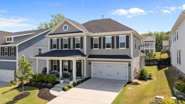 2012 Sweet Samson St, Wake Forest, NC 27587 - traditional-style home with covered porch, concrete driveway, an attached garage, and a shingled roof