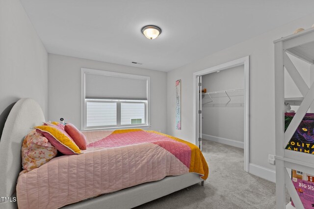 2012 Sweet Samson St, Wake Forest, NC 27587 - carpeted bedroom featuring a spacious closet, baseboards, and a closet