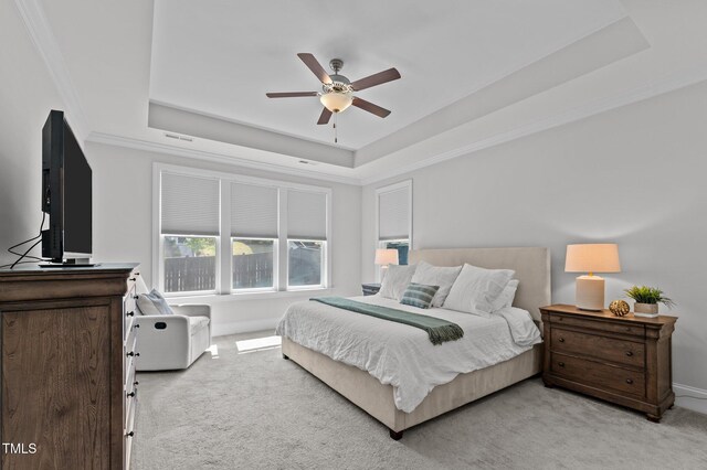 2012 Sweet Samson St, Wake Forest, NC 27587 - bedroom featuring a tray ceiling, light colored carpet, ornamental molding, baseboards, and a ceiling fan