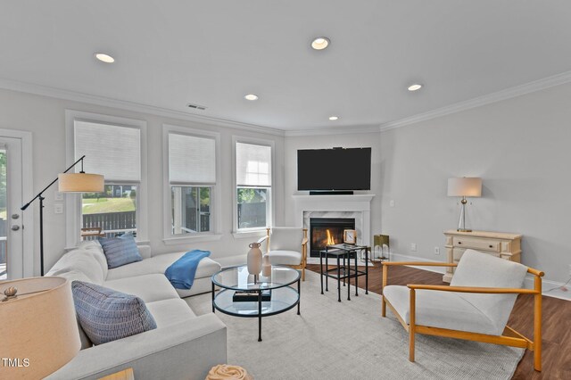 2012 Sweet Samson St, Wake Forest, NC 27587 - living room featuring crown molding, light wood-style floors, recessed lighting, a premium fireplace, and baseboards