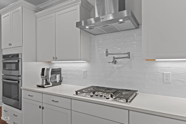 2012 Sweet Samson St, Wake Forest, NC 27587 - kitchen with extractor fan, stainless steel appliances, white cabinets, light countertops, and backsplash
