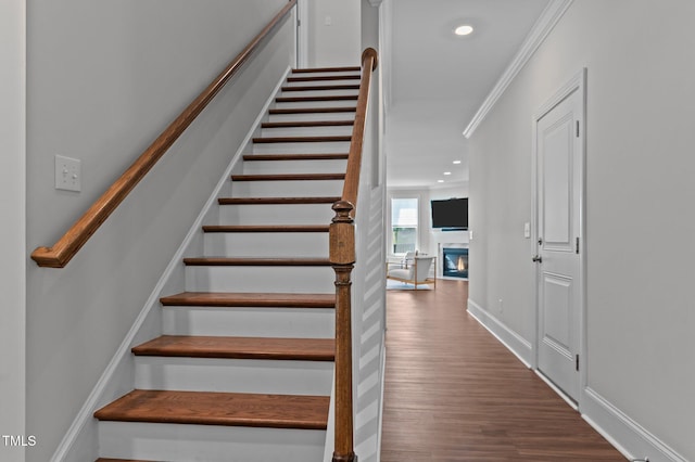 2012 Sweet Samson St, Wake Forest, NC 27587 - staircase with wood finished floors, recessed lighting, a glass covered fireplace, baseboards, and ornamental molding