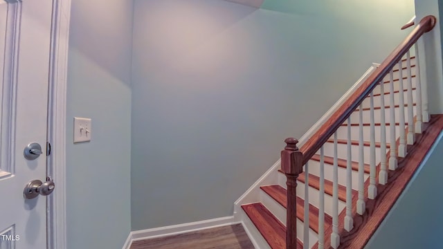 151 Braeside Ct, Cary, NC 27519 - stairs featuring wood finished floors and baseboards