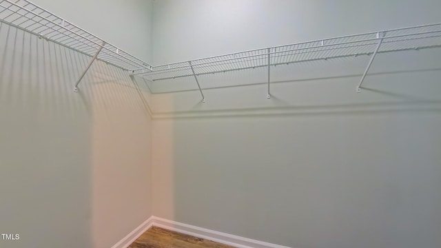 151 Braeside Ct, Cary, NC 27519 - walk in closet featuring wood finished floors