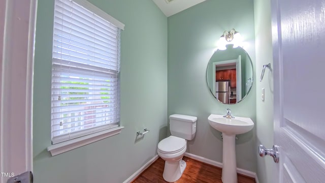 151 Braeside Ct, Cary, NC 27519 - half bath with toilet, wood finished floors, and baseboards
