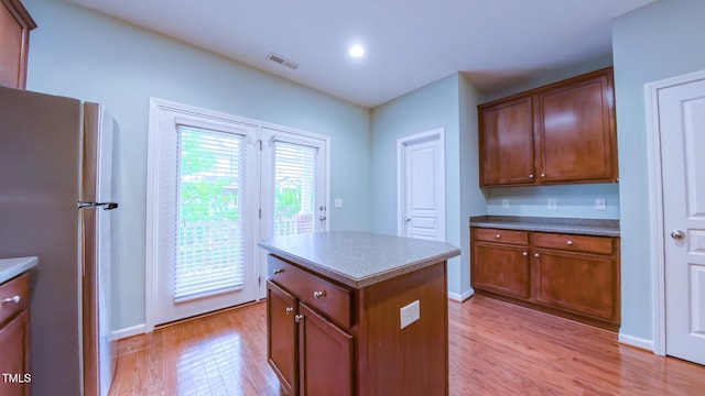 151 Braeside Ct, Cary, NC 27519 - kitchen featuring freestanding refrigerator, light wood-style flooring, a center island, baseboards, and recessed lighting